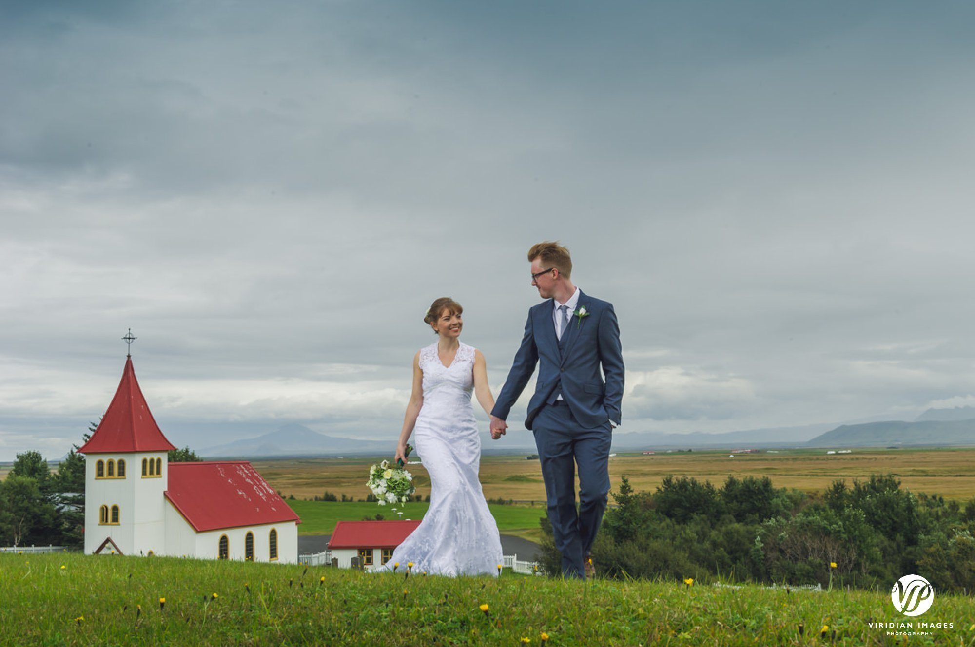 Bride and groom portraits front of Oddikirkja church in Hella Iceland