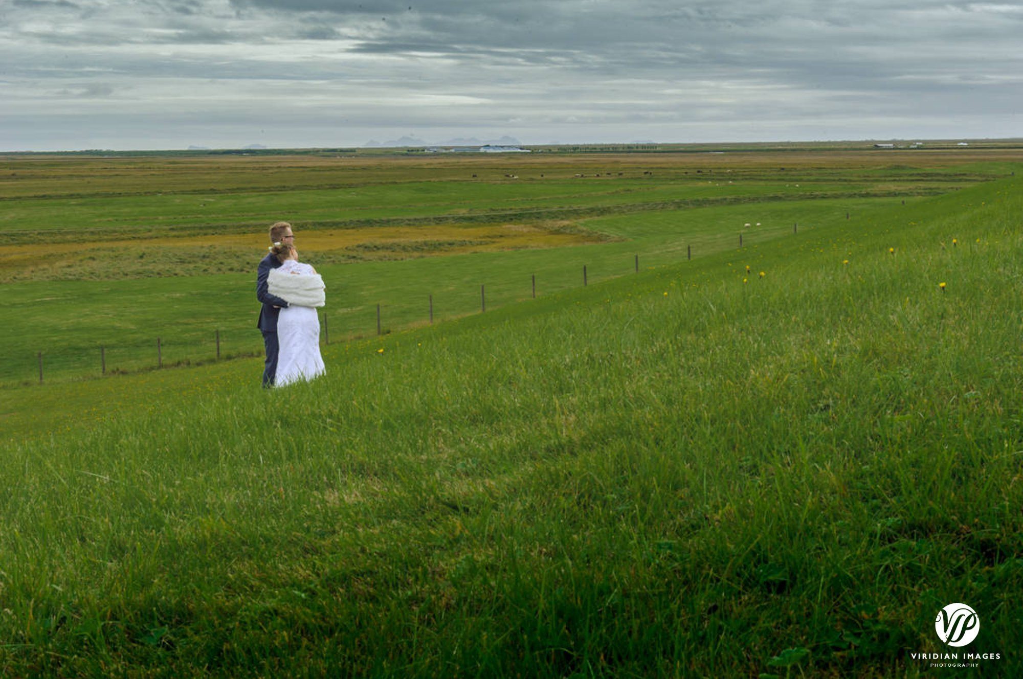 Bride and groom private moment enjoying scenery around Hella Iceland