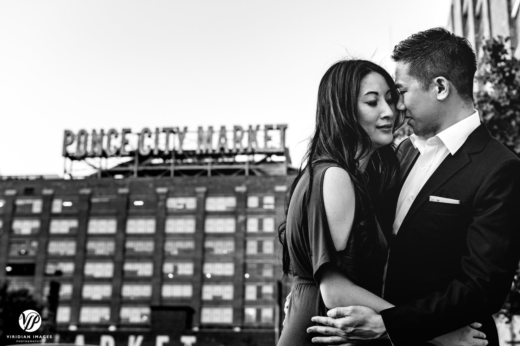 romantic couple front of ponce city market sign