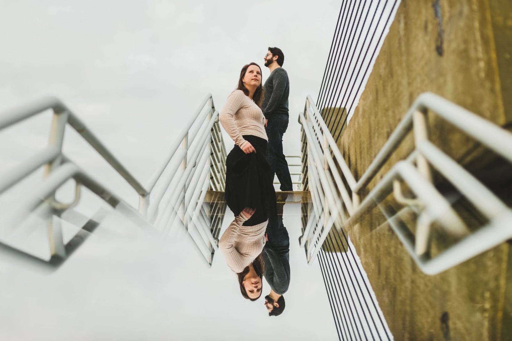 reflection shot of couple on stairs