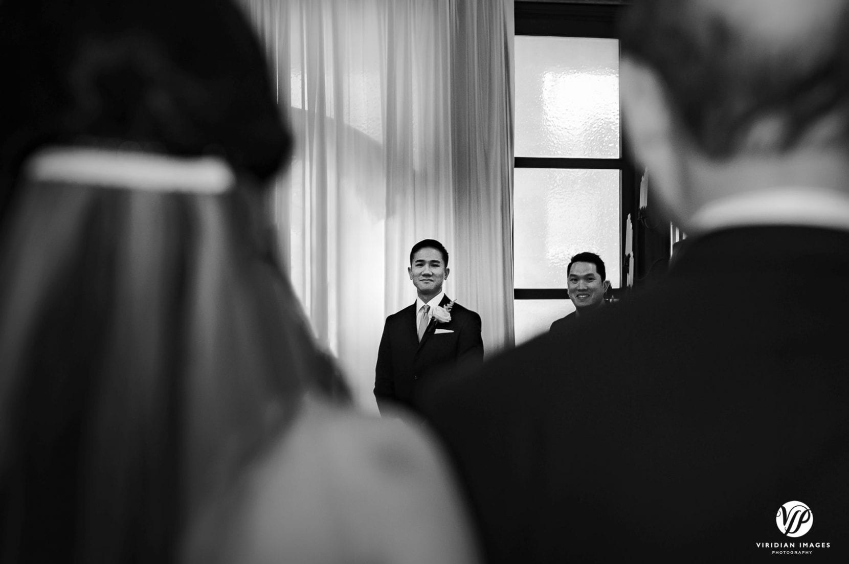 ceremony groom sees bride with father