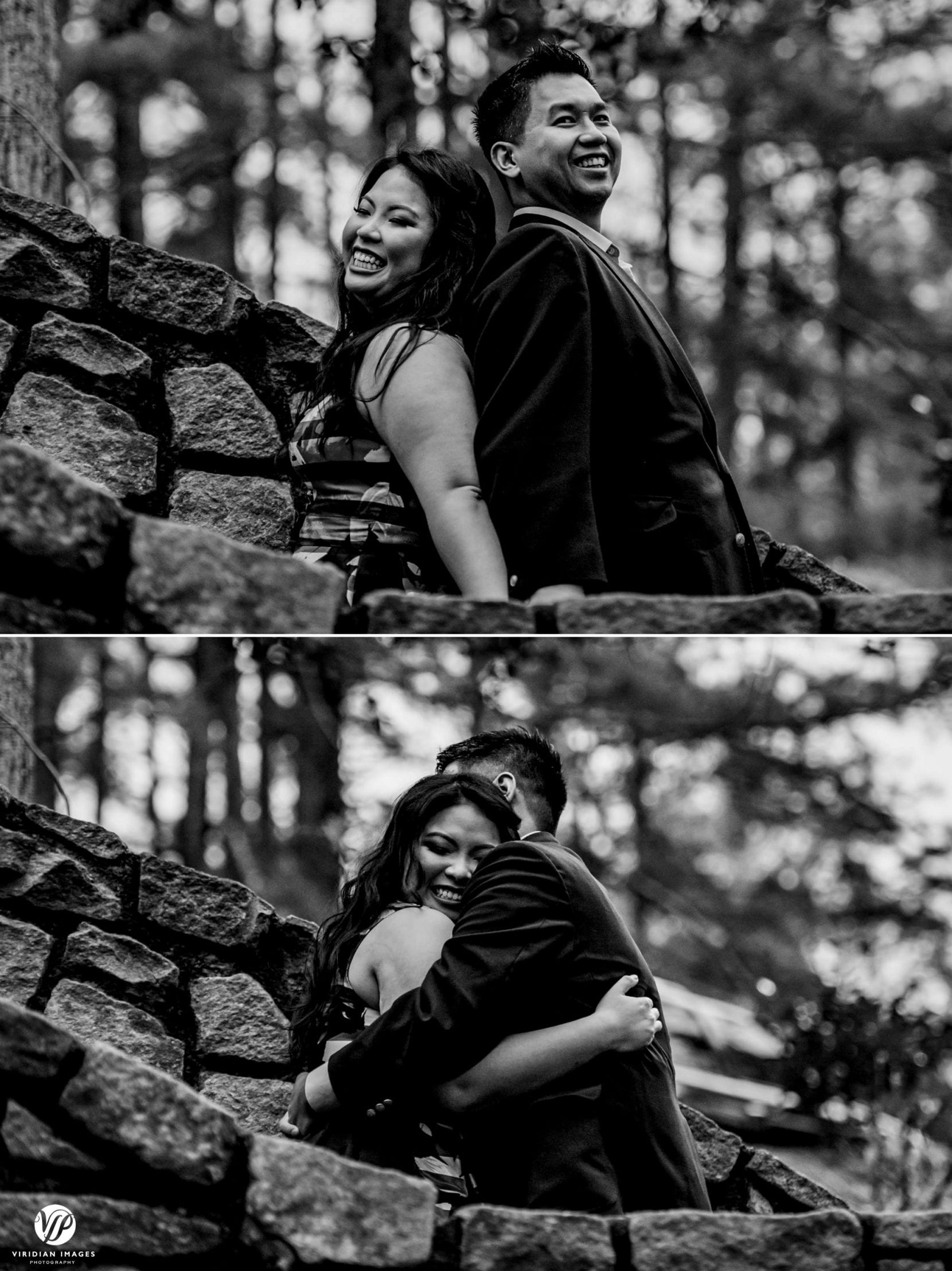 couple laughing back to back on stone stairs engagement photo session stone mountain park atlanta