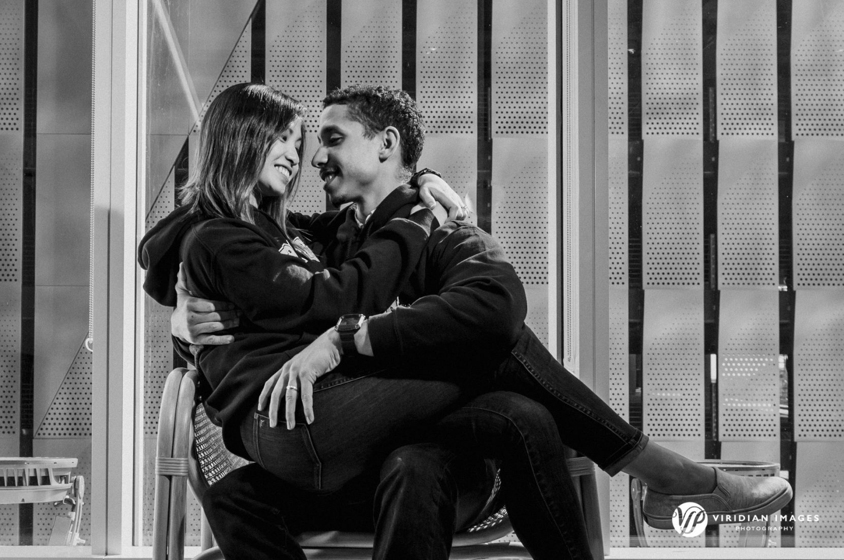 Couple shares a moment inside Georgia Tech's break room during engagement session