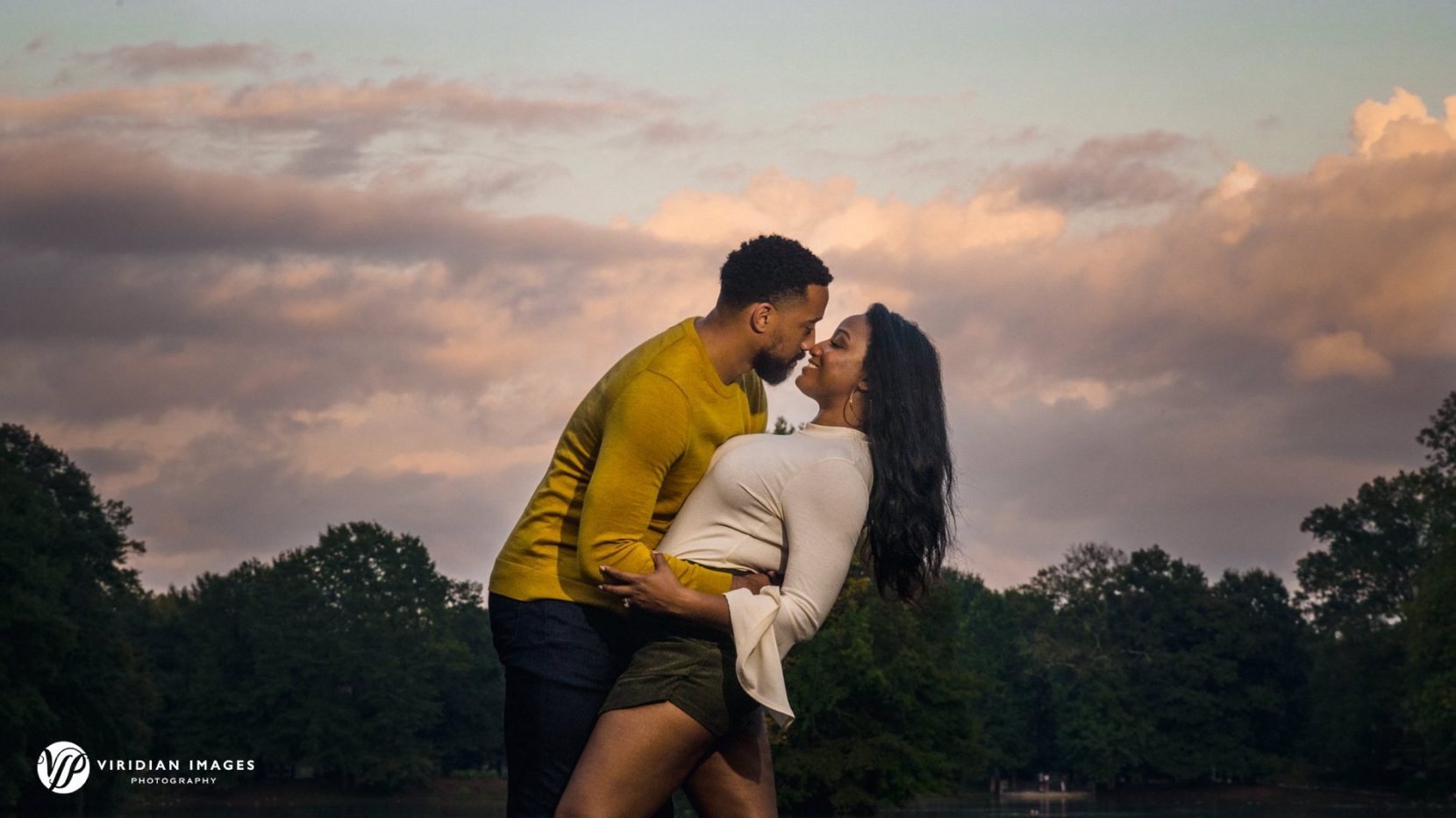 romantic photo of couple against golden hour sky in Atlanta