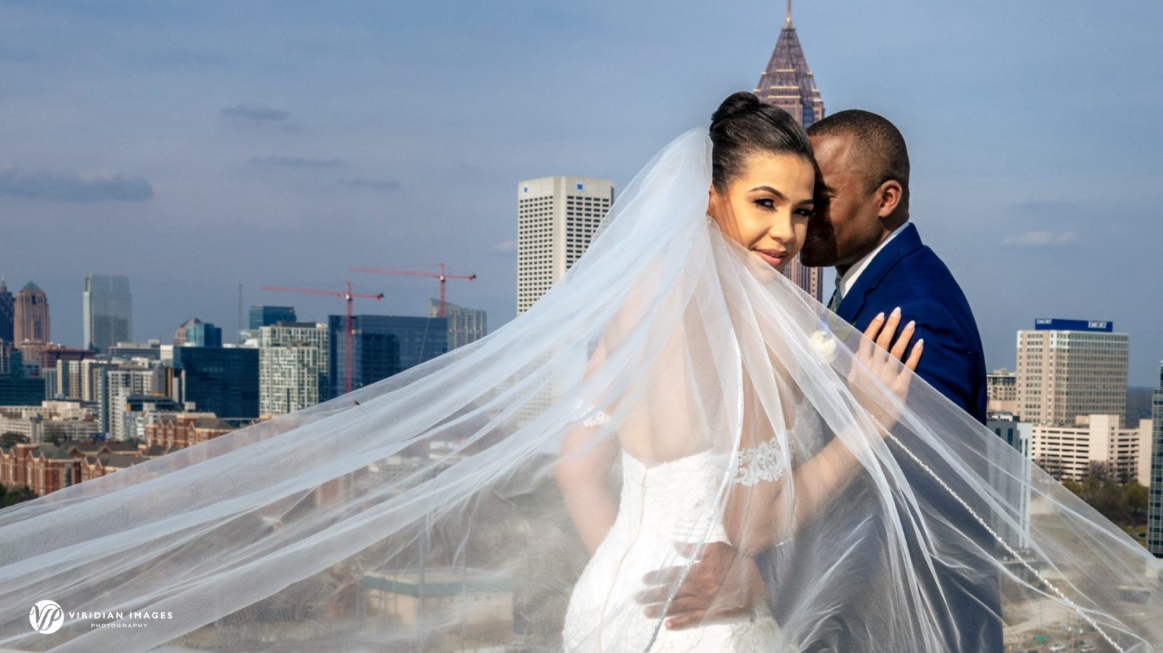 wedding portrait on top of Ventanas helipad skyline