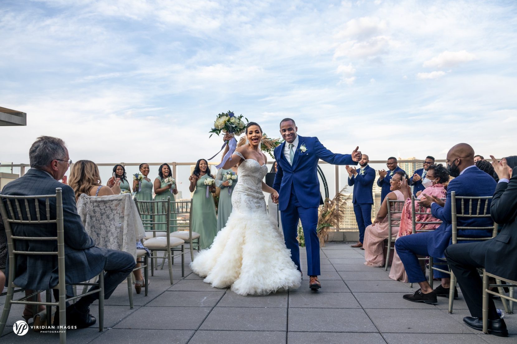 couple dancing down aisle during wedding recessional after ceremony